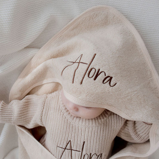 Beige hooded bath towel embroidered with baby name