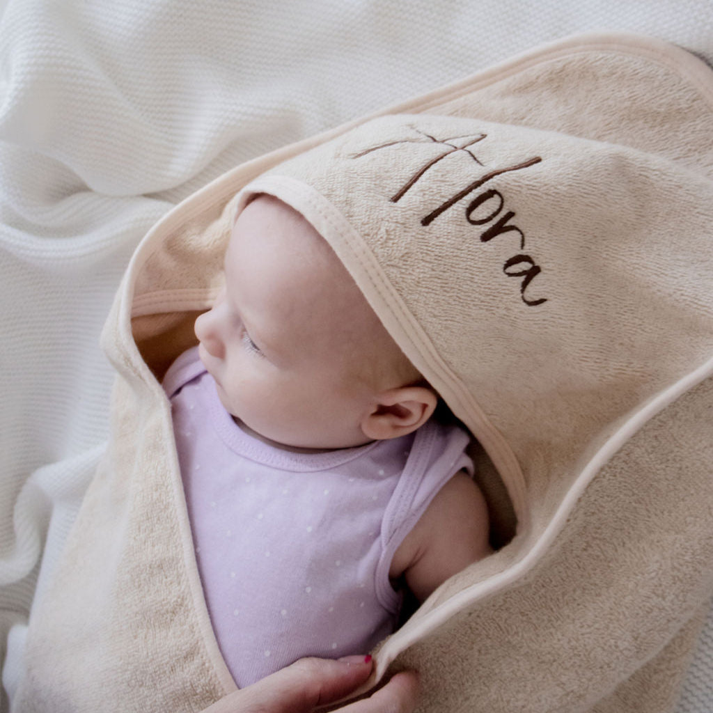 Beige hooded bath towel embroidered with baby name