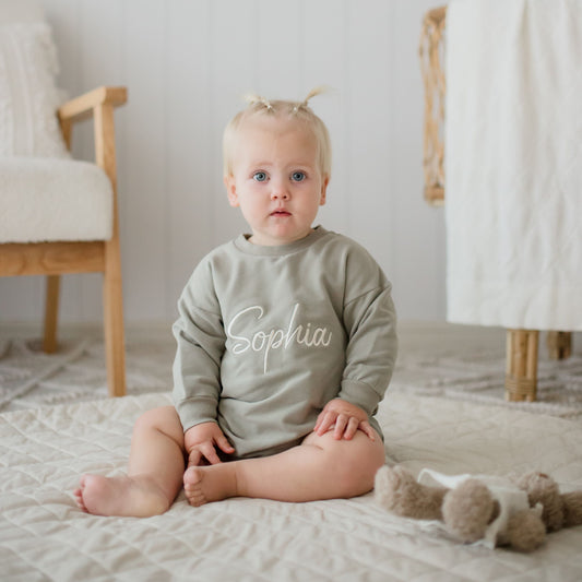 Green Romper personalised with embroidery. Childs name embroidered