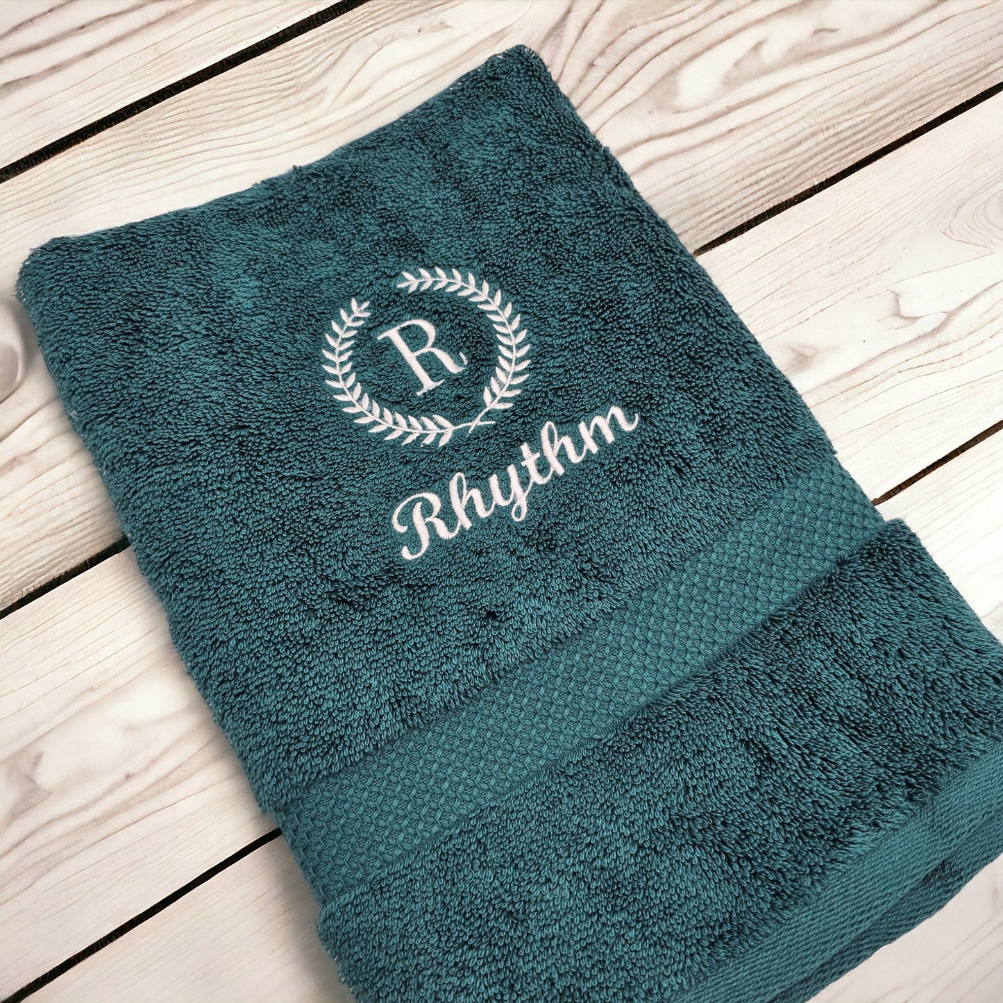 PErsonalised hand towel with leaf frame embroidery and a name