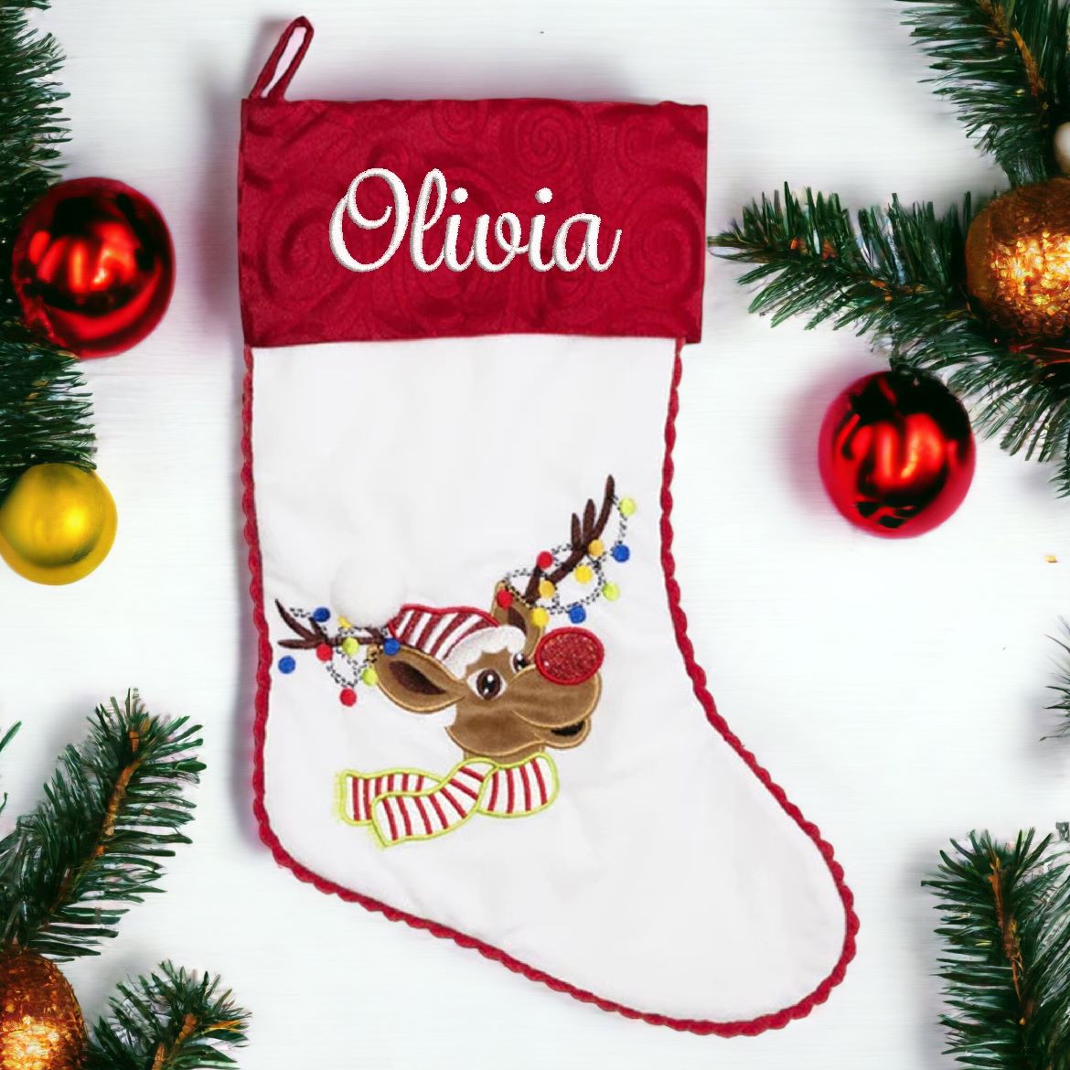 White Christmas stocking with embroidered reindeer personalised with name