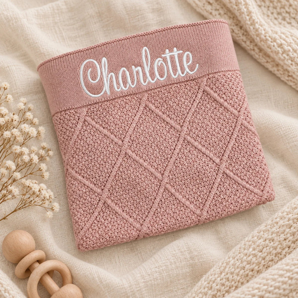 Dusty Pink Diamond Knit Blanket embroidered with the name Charlotte 